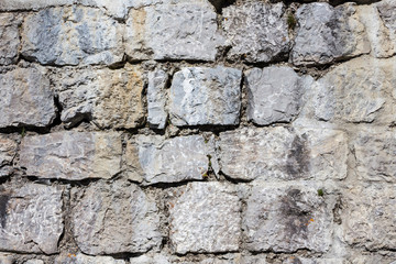 Fototapeta premium Background. Stacked Stone Wall, close up