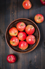 Red apples on a dark rustic background