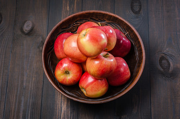 Red apples on a dark rustic background