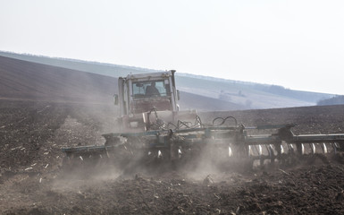 Harrowing the soil with disc harrows