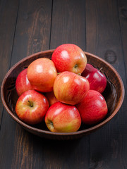 Red apples on a dark rustic background