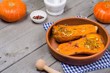 Baked pumpkin in a clay dish.