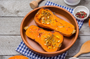 Baked pumpkin in a clay dish.
