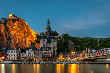 Dinant at night with dark blue sky 