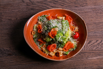 Caesar salad with salmon