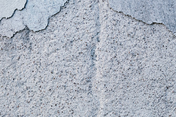 The gray old wall. Cracked concrete. Close-up