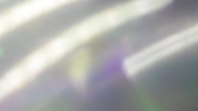 Colorful bokeh. Holographic iridescent foil. Multicolored shiny surface and shining abstract background.