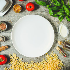 pasta with tomato sauce (set of ingredients) on the table. top view. food background