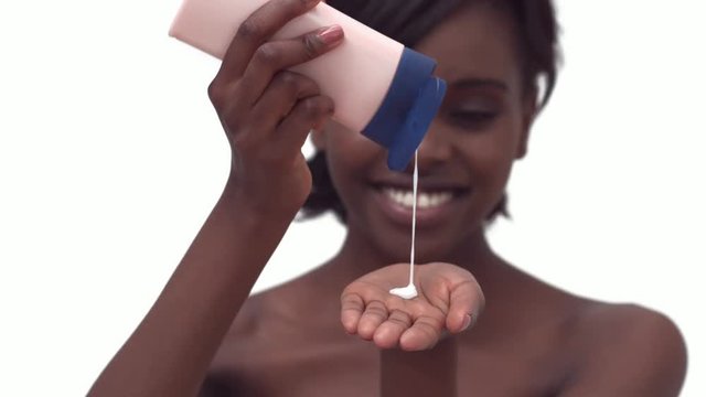 Loop of Woman pouring lotion into her hands