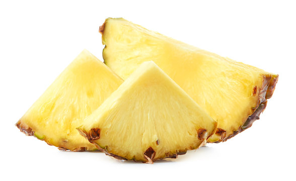 Fresh pineapple slices isolated on white background