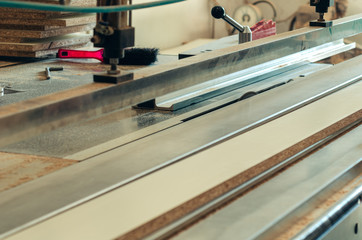 Production of cabinet furniture, cutting parts on a format machine