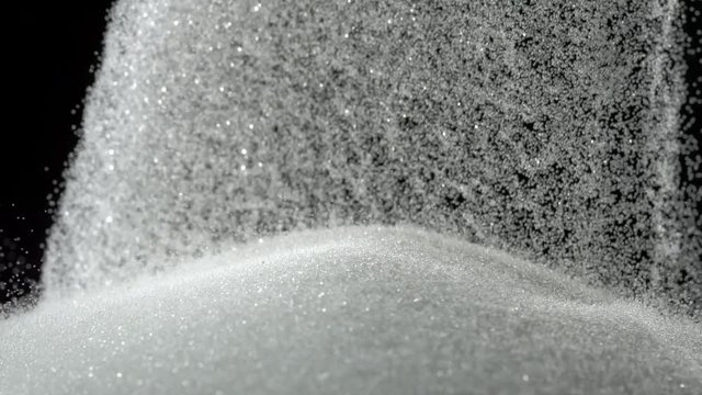 Loop of Pile of sugar on black background shooting with high speed camera, phantom flex.