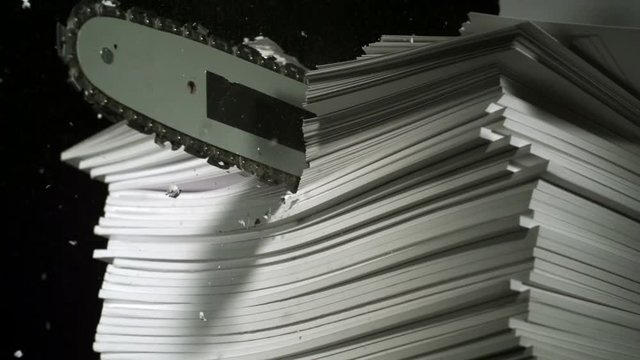 Loop of Chainsaw cutting pile of book shooting with high speed camera, phantom flex.