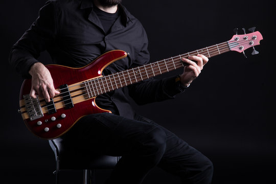 Man Playing Five String Bass Guitar