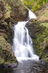Fototapeta na wymiar Ben Bhraggie waterfall in Scotland.