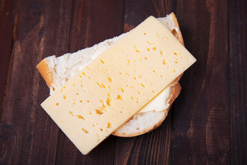 Homemade cheese sandwich on wooden background