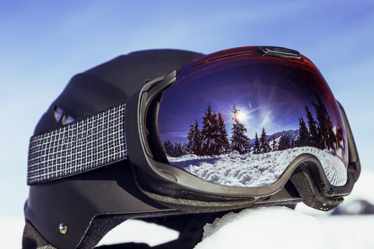 Winter Alpes landscape reflection on snowboarders helmet. Portes du Soleil.