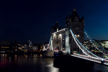 Obraz premium Iconic Tower bridge with lights on in London, UK at dark night.
