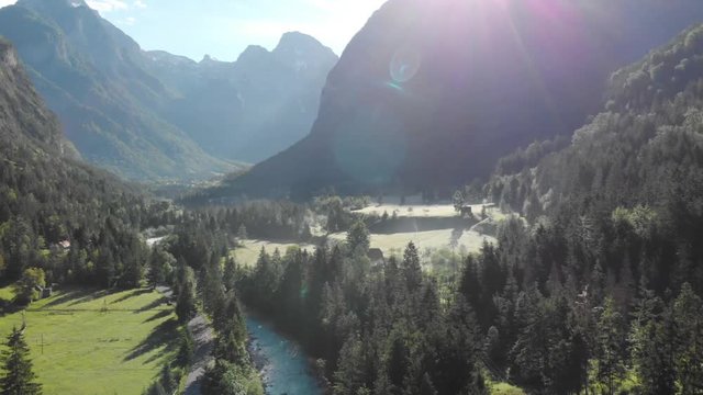 Aerial drone view over Soca river valley at sunny foggy morning