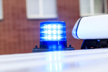 police car on her flashers blue. close-up