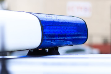 police car on her flashers blue. close-up