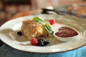 a pie with a berry sauce