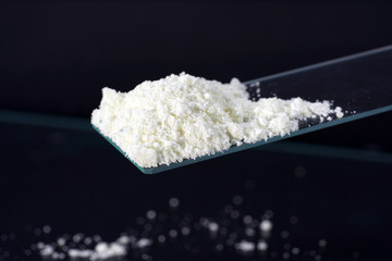 Potassium hexacyanoferrate is used in chemistry lessons to grow red, monoclinic crystals. 
