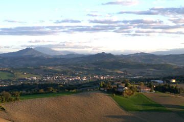 countryside,panorama,landscape,hills,village,crops,field,mountains,view,clouds,agriculture
