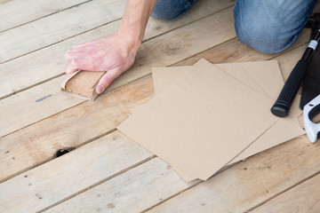 Man working with sand paper in carpentry trade