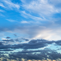 Fototapeta premium white clouds in blue sky over dark clouds