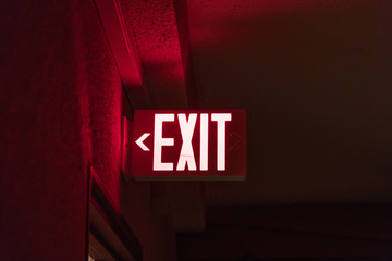 conceptual red exit sign - Powered by Adobe
