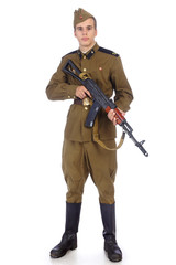 A soldier in military uniform of soviet army stay and hold Kalashnikov rifle