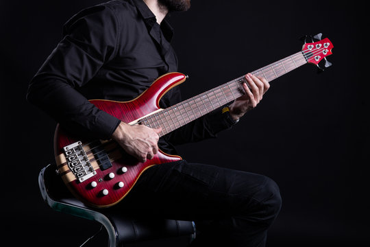 Man Playing Electric Bass Guitar with Slap Technique