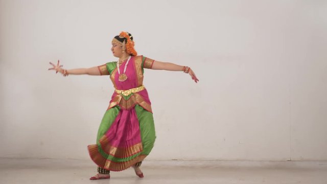 Different steps of Indian Classical Dance Bharat Natyam performed by Indian young girl.