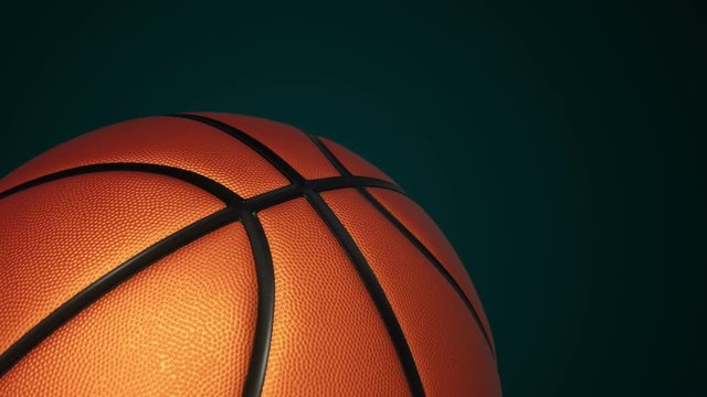 Animation of slow rotation ball for basketball game. View of close-up with realistic texture and light. Animation of seamless loop.
