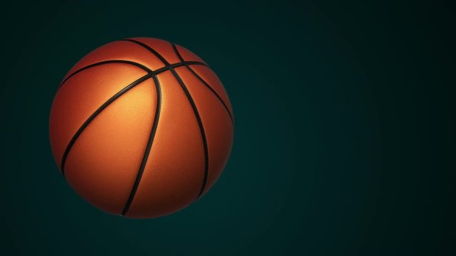 Animation of slow rotation ball for basketball game. View of close-up with realistic texture and light. Animation of seamless loop.