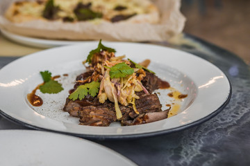 Vkusnoe, delicious hot dish of meat with vegetables and spices