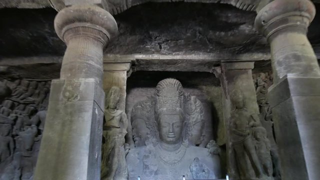 Mumbai, India:4K footage of Elephanta cave interior Trimurti sculpture, on Elephanta island near Mumbai. This is one of the UNESCO World heritage Site.