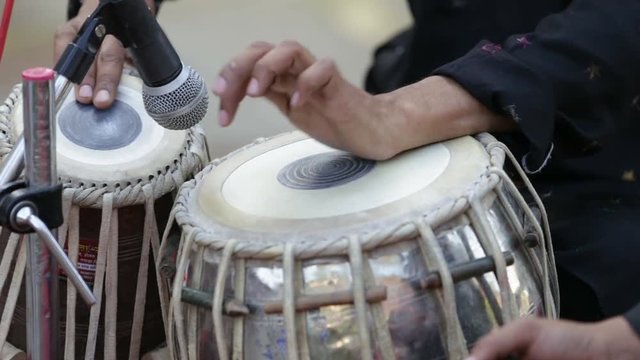  Hands of a musician playing Tabla drum, India.