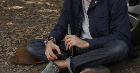 Rugged man waiting for road assitance