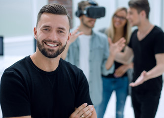 Cheerful colleagues testing virtual reality glasses