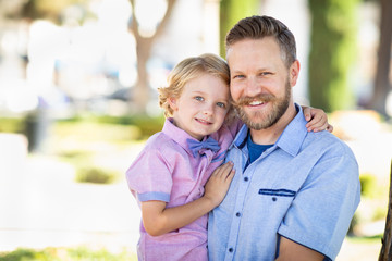 Obraz premium Young Caucasian Father And Son Portrait At The Park