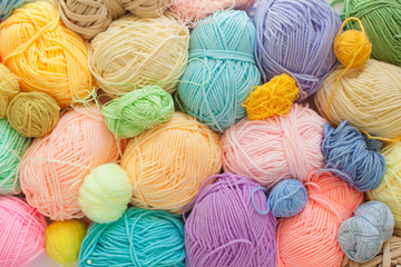 Colored balls of yarn. View from above. Rainbow colors. All colors. Yarn for knitting. Skeins of...