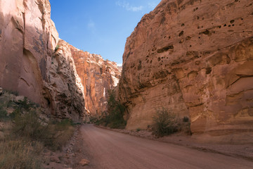 Dirt road to the gorge between the red rocks. Capitol Reef National Park, Utah, USA