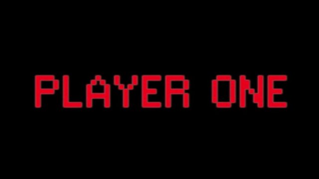 A flashing text with the words Player One. Red on black, blocky 8-bit characters, faded color tone.
