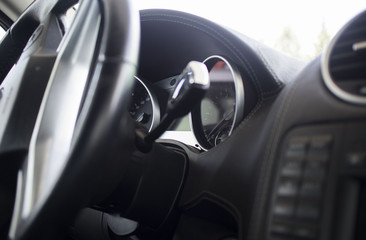 Interior of premium sedan car. steering wheel and dashboard of the car