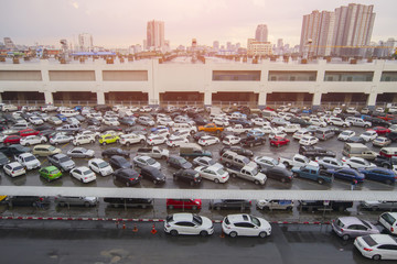 Blurred images of cars parked in the city. © yongyut