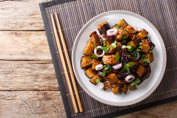 Spicy Sichuan eggplant is also known as fish fragrant eggplant (Yu Xiang) closeup on a plate....