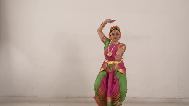 Different steps of Indian Classical Dance Bharat Natyam performed by Indian young girl.