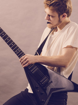 Man playing on electric guitar